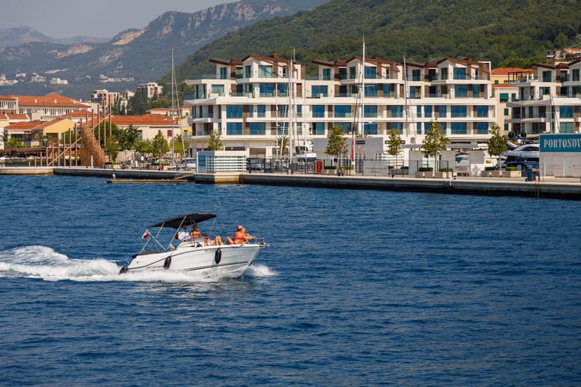 The Budva Riviera, hidden coves and boat trips on the bay — clear Adriatic water and a glamorous, growing marina scene at Porto Montenegro.
