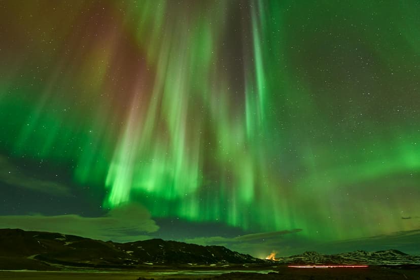 From roughly September to April, the aurora dances over the dark Icelandic skies — chased by guided tour or watched from a remote countryside lodge.