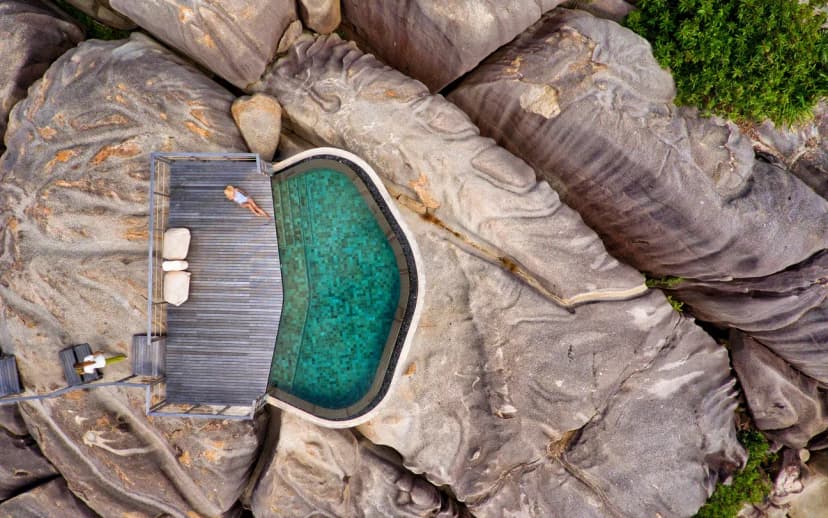A spa on the rocks — the activity/scene in action. Treatment villas set across the granite boulders.