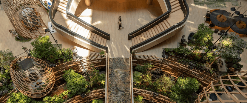 The garden atrium: 2,400+ plants and songbirds at breakfast.