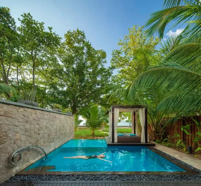 Beach pool villas — the activity/scene in action. Villas opening straight onto the sand.