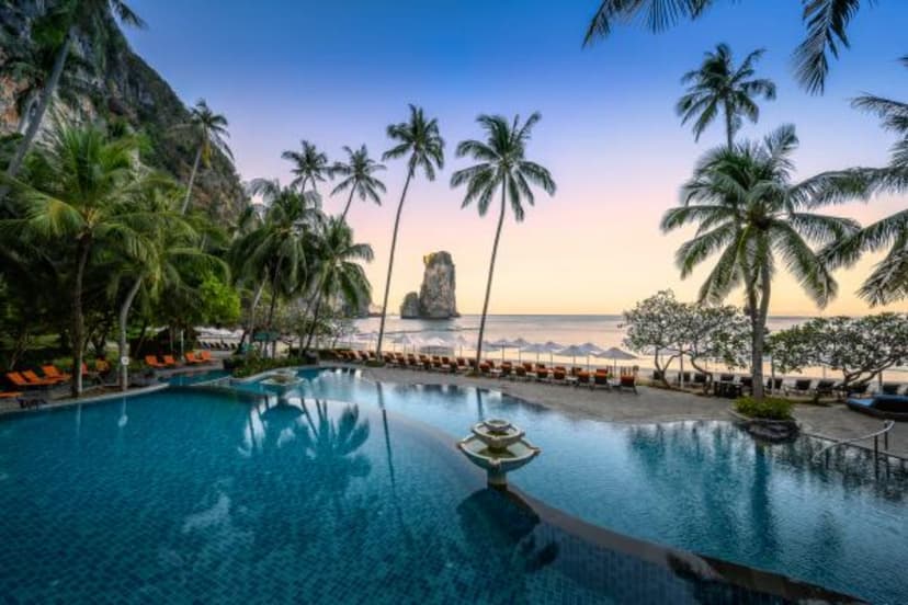 Hero/establishing shot of Centara Grand Beach Resort & Villas Krabi, Krabi, Thailand. A large family beach resort in the secluded private bay of Pai Plong, near Ao Nang in Krabi, framed by limestone cliffs within a national park and reached