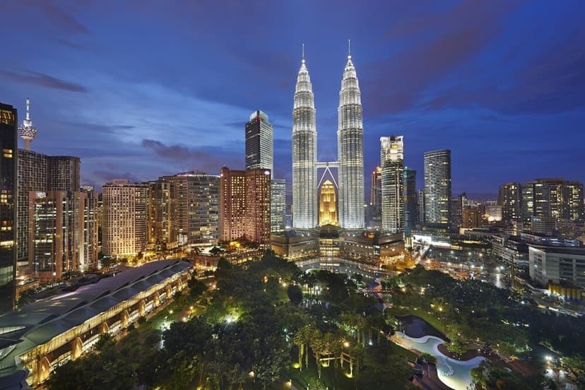 Hero/establishing shot of Mandarin Oriental, Kuala Lumpur, Kuala Lumpur, Malaysia. A Kuala Lumpur City Centre landmark between the 88-storey Petronas Twin Towers and the 50-acre KLCC Park — home to an infinity-edge pool at treetop level wit
