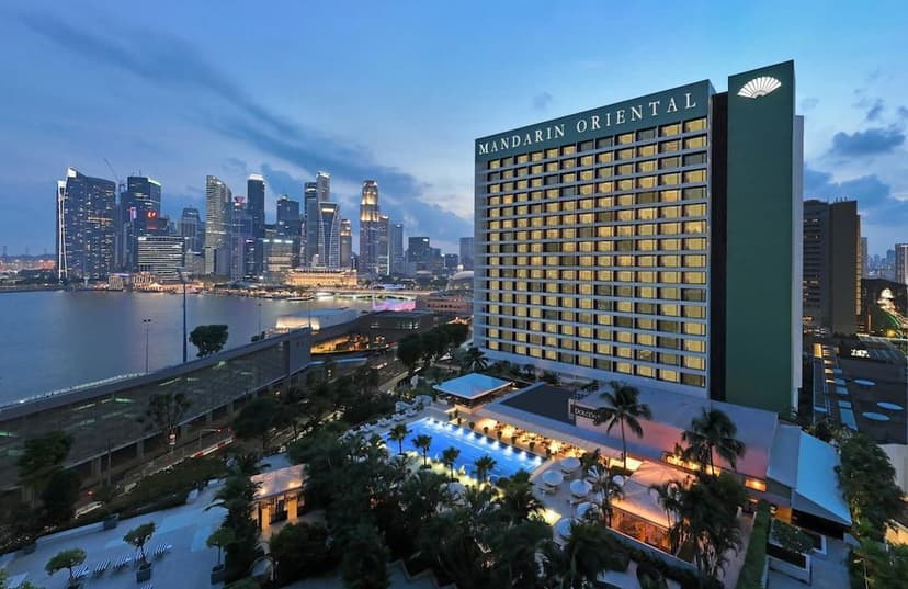 Hero/establishing shot of Mandarin Oriental, Singapore, Singapore. A contemporary Marina Bay city hotel reopened in 2023 after a $100M-plus renovation — among the freshest rooms on the bay, with rooms designed to their view.