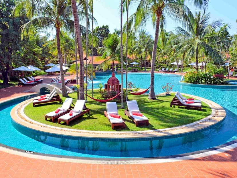 Hero/establishing shot of Sofitel Angkor Phokeethra Golf & Spa Resort, Siem Reap, Cambodia. A large French-colonial-style golf-and-spa resort ten minutes from Angkor Wat — the full-facility, family and MICE base in Siem Reap.