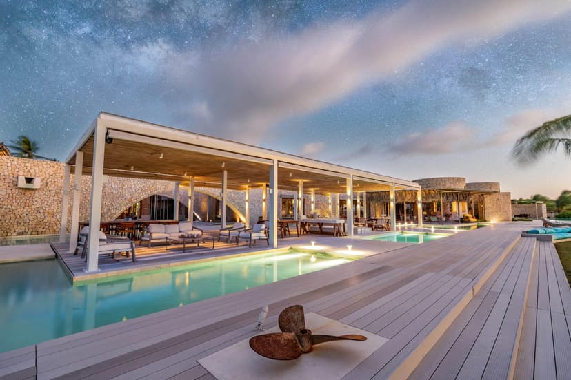 Signature hero of Miavana by Time + Tide (Nosy Ankao, Madagascar): the single most iconic wide view — Private island, Helicopter arrival, All-inclusive. Golden-hour, landscape, room to overlay text.