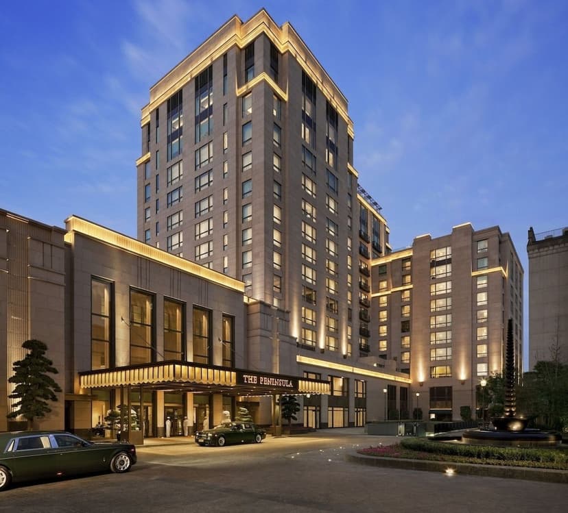 Hero/establishing shot of The Peninsula Shanghai, Shanghai, China. A modern Art Deco grand hotel with direct frontage on the historic Bund — the first new building on the Bund in more than 60 years, with Forbes Five-Star and Michelin Two-Ke