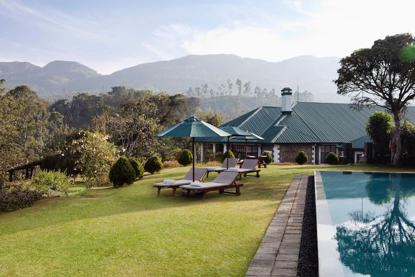 Hero/establishing shot of Ceylon Tea Trails, Hill Country, Sri Lanka. The world’s first tea-bungalow resort — five restored colonial planters’ bungalows on a working Dilmah tea estate in the Bogawantalawa Valley, the only Relais & Châteaux 