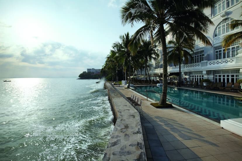 Hero/establishing shot of Eastern & Oriental Hotel, Penang, Penang, Malaysia. A seafront colonial grande dame of 1885 — the only hotel with prime sea frontage inside the George Town UNESCO World Heritage Site, built by the Sarkies brothers 