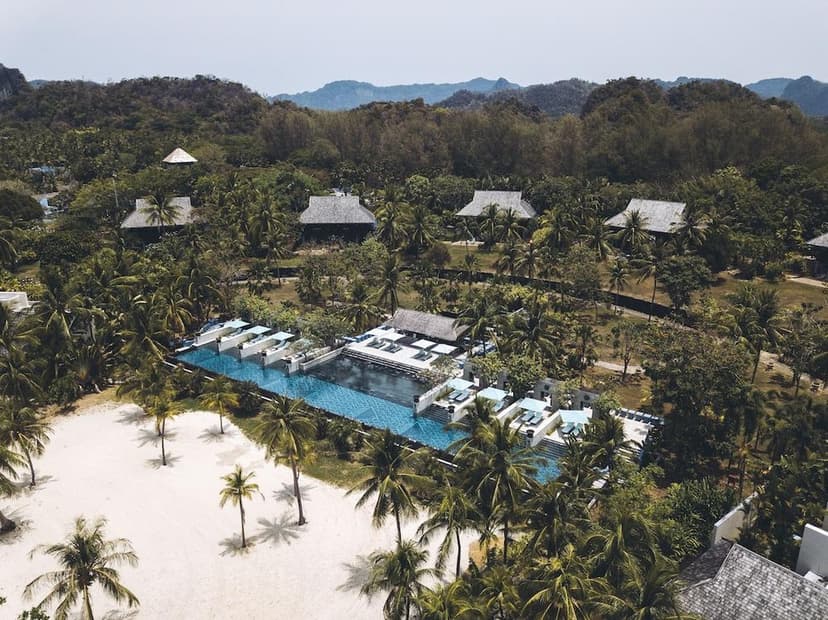Hero/establishing shot of Four Seasons Resort Langkawi, Langkawi, Malaysia. A Bill Bensley-designed Four Seasons on Tanjung Rhu’s mile-long beach, beside Malaysia’s first UNESCO Global Geopark (the Kilim Karst Geoforest Park).