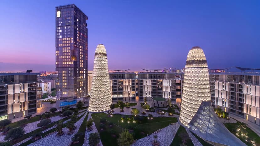 Hero/establishing shot of Banyan Tree Doha at La Cigale Mushaireb, Doha, Qatar. A downtown luxury tower hotel within Doha Oasis, with Jacques Garcia design and the Banyan Tree signature rainforest spa.