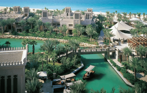 Hero/establishing shot of Jumeirah Dar Al Masyaf, Dubai. An all-villa ‘Arabian village’ of butler-served summerhouses within Madinat Jumeirah, threaded by abra waterways.