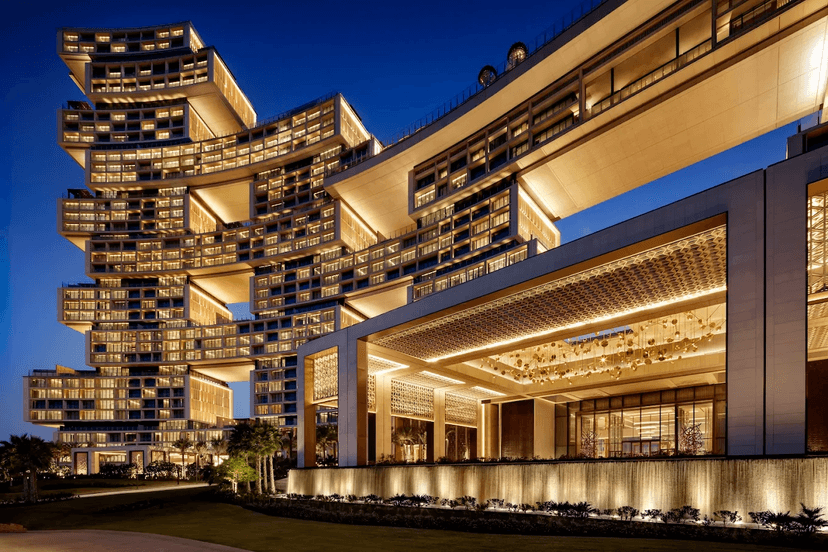 Hero/establishing shot of Atlantis The Royal, Dubai. Dubai’s most talked-about modern opening — a stacked-block landmark on Palm Jumeirah with a sky bridge, the celebrity-chef capital of the city.