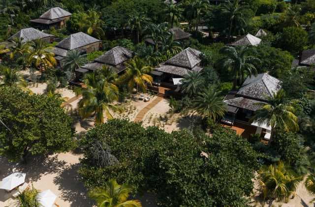 Hero/establishing shot of Hermitage Bay, Antigua. An intimate thirty-suite, Green Globe-certified eco-luxury all-inclusive on a secluded west-coast bay.