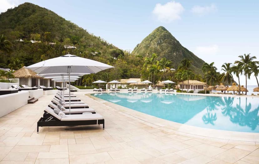 Hero/establishing shot of Sugar Beach, A Viceroy Resort, St Lucia. A Viceroy resort set literally between the two Pitons, on a rare white-sand beach in a hundred acres of rainforest.