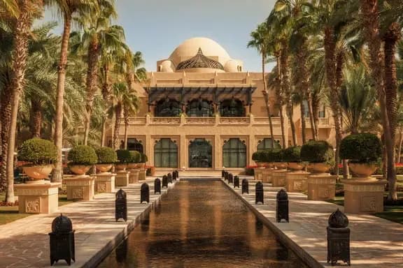 Hero/establishing shot of One&Only Royal Mirage, Dubai. A timeless Arabian-palace beachfront resort across three distinct houses in 65 acres of gardens, with a kilometre of private beach.