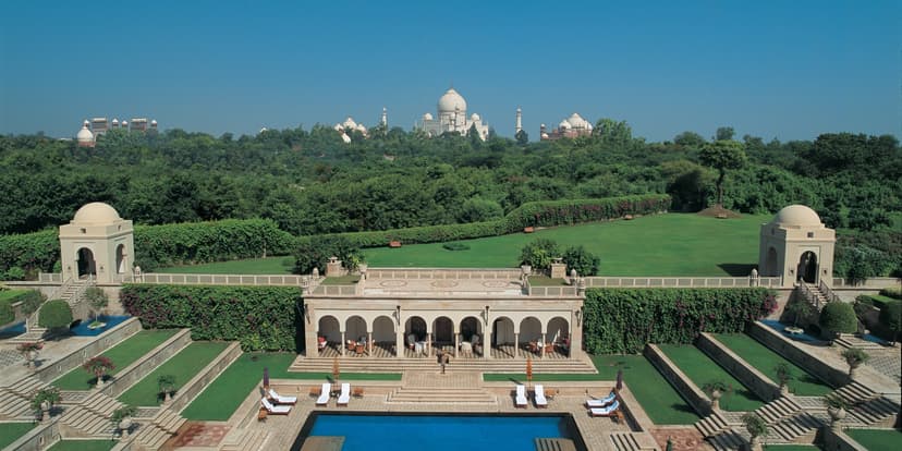 Hero/establishing shot of The Oberoi Amarvilas, Agra, Agra, India. The Agra Taj-view icon — a Mughal-palace-style resort 600 metres from the Taj Mahal, the only Agra hotel with uninterrupted Taj views from every room (and the pool, bar and