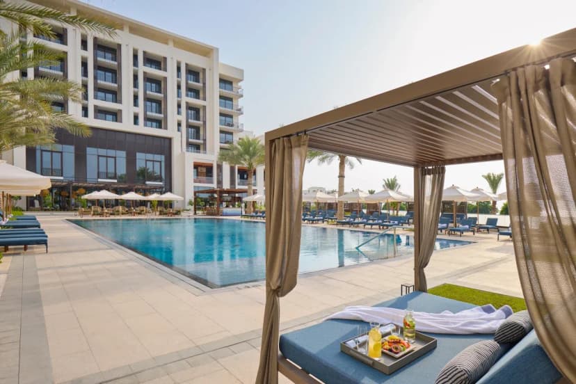Hero/establishing shot of Mandarin Oriental, Muscat, Muscat, Oman. A new prestige icon on Shatti Al Qurm’s beach promenade, next to the Royal Opera House — contemporary Omani-inspired design by Xavier Cartron, with unusually large marble rooms.