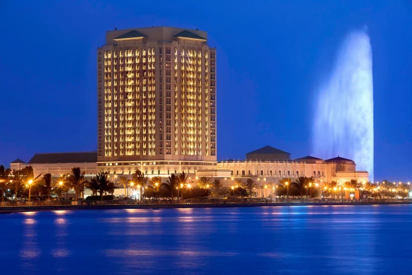Hero/establishing shot of The Ritz-Carlton, Jeddah, Jeddah, Saudi Arabia. A palatial corniche hotel of royal-guesthouse origin on Jeddah’s Southern Corniche, overlooking the Red Sea and the King Fahd Fountain.