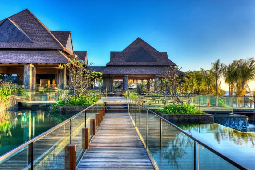 Signature hero of The Westin Turtle Bay Resort & Spa (Northwest Coast, Mauritius): the single most iconic wide view — Wellness-led, All-suite, Protected marine park. Golden-hour, landscape, room to overlay text.