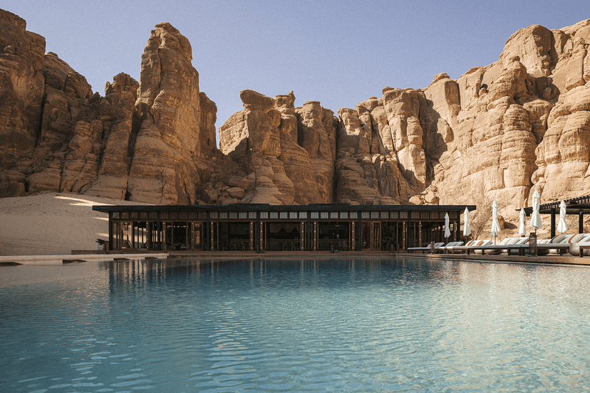 Hero/establishing shot of Our Habitas AlUla, AlUla, Saudi Arabia. A sustainable, experience-led desert resort in AlUla’s Ashar Valley box canyon, with villas folded into an ancient oasis and palm groves.