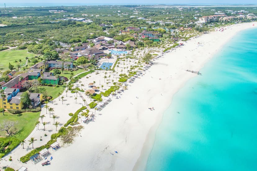 Hero/establishing shot of Club Med Turkoise, Providenciales, Turks & Caicos. The only adults-only all-inclusive on Grace Bay — the world's number-one beach at a fraction of the neighbours' price.