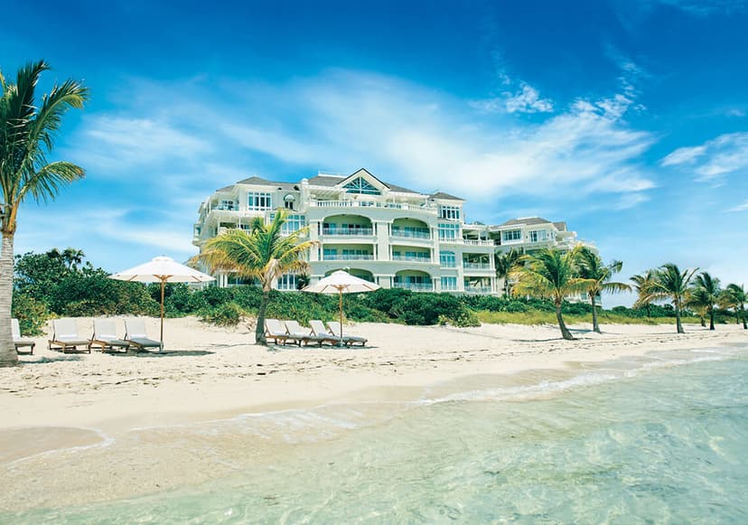 Hero/establishing shot of The Shore Club, Providenciales, Turks & Caicos. The premier resort on secluded Long Bay — Turks & Caicos' kiteboarding capital — in low-density Barbadian-village design.
