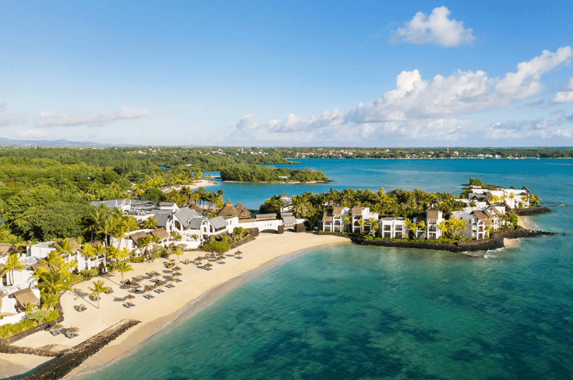 Signature hero of Shangri-La Le Touessrok (East Coast, Mauritius): the single most iconic wide view — Two private islands, Championship golf, All sea-facing. Golden-hour, landscape, room to overlay text.