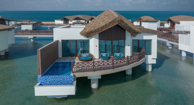 Hero/establishing shot of Anantara Mina Al Arab Ras Al Khaimah Resort, Ras Al Khaimah. Ras Al Khaimah’s first overwater villas — a Maldives-inspired eco-luxury resort on a private peninsula in a mangrove sanctuary, barely an hour from Dubai.